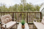 Enjoy the tranquility of nature from this charming outdoor space.