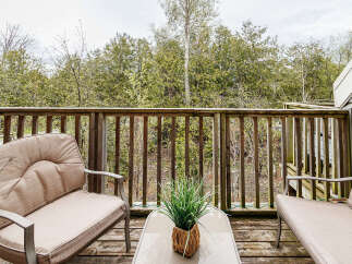 Enjoy the tranquility of nature from this charming outdoor space.