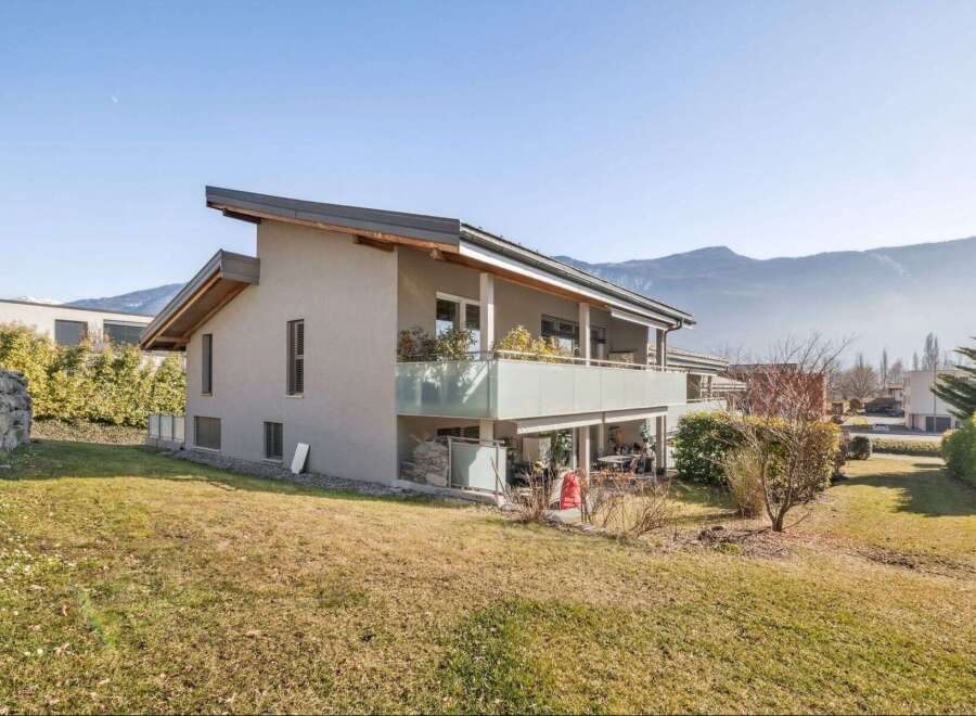 Discover this stunning property with modern architecture and a serene mountain backdrop.