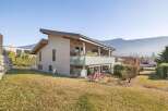 Discover this stunning property with modern architecture and a serene mountain backdrop.
