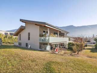 Discover this stunning property with modern architecture and a serene mountain backdrop.