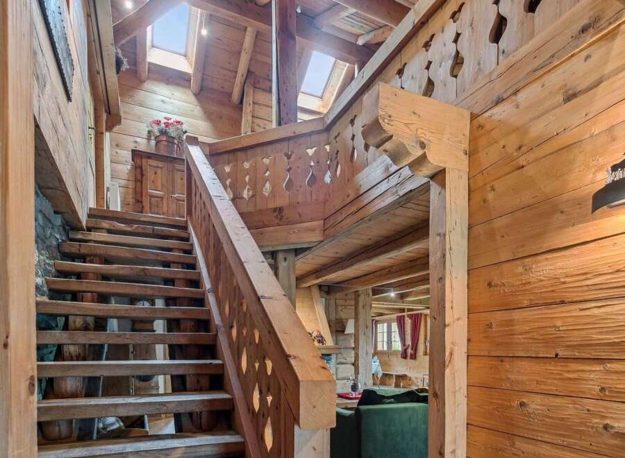 Step into rustic elegance with this stunning wooden staircase.
