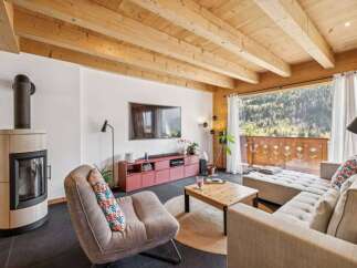 Experience the charm of this stunning living space, featuring a cozy fireplace and a modern entertainment setup.