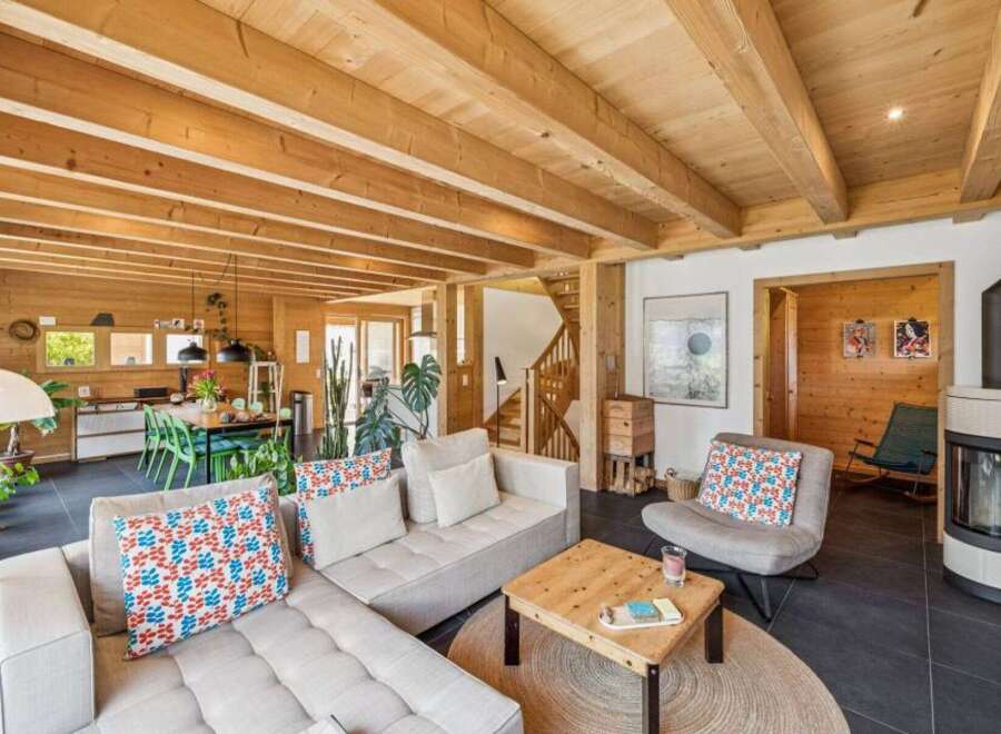 Step into a world of rustic elegance with this stunning property, showcasing a harmonious blend of natural wood elements and modern design.