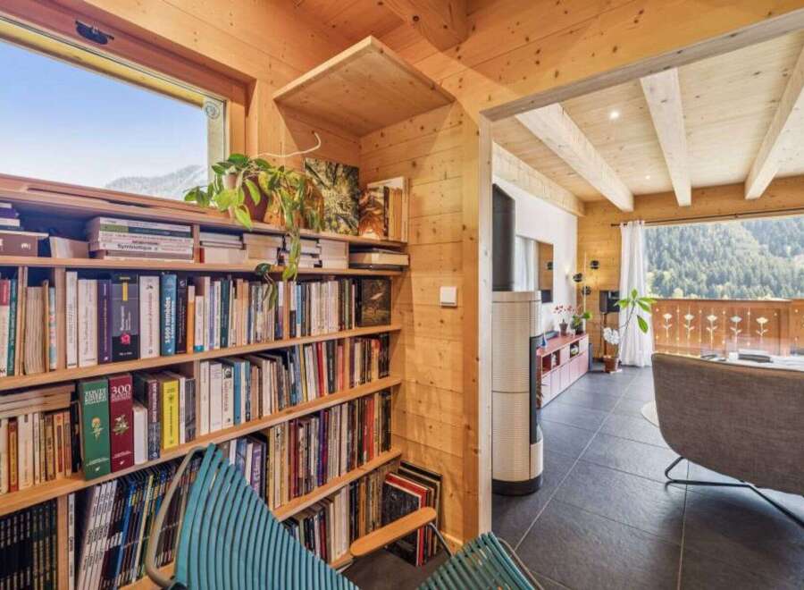 This cozy cabin boasts a stunning view and a warm, inviting interior.