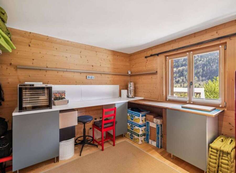 This charming property boasts a cozy workspace with ample natural light, perfect for creative endeavors or remote work.