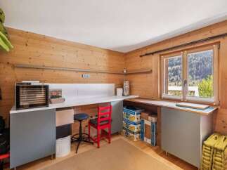 This charming property boasts a cozy workspace with ample natural light, perfect for creative endeavors or remote work.