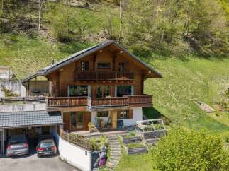 This stunning wooden chalet offers a perfect blend of rustic charm and modern comfort.