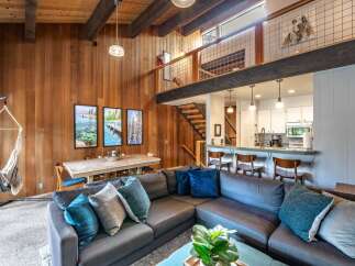 This stunning property boasts a warm and inviting interior with a unique architectural design.