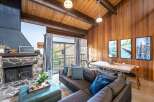 Step into this inviting living space, featuring a cozy stone fireplace and a stylish sectional sofa.