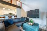This stunning property boasts a modern living space, perfect for relaxation and entertainment.