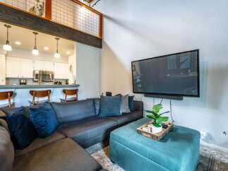 This stunning property boasts a modern living space, perfect for relaxation and entertainment.