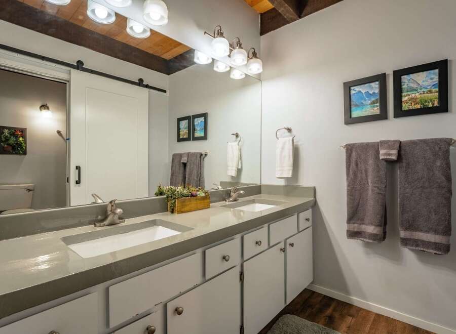 This stunning bathroom boasts a modern design with a touch of rustic charm.
