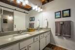 This stunning bathroom boasts a modern design with a touch of rustic charm.