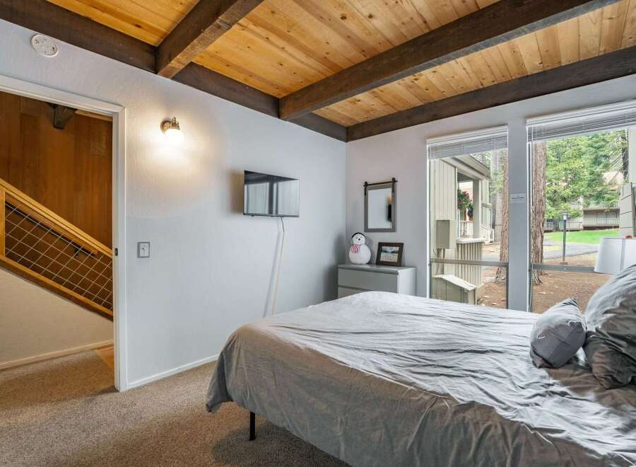 This cozy bedroom features a comfortable bed, perfect for relaxing after a long day.