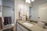 This bathroom features a modern design with a sleek countertop and a stylish sink.