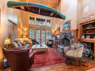 Step into rustic luxury with this stunning cabin-style living room.