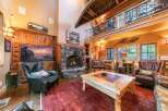 Step into rustic luxury with this stunning cabin-style living room.