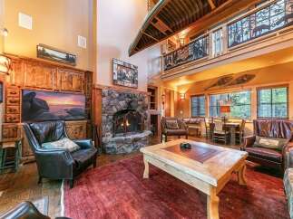 Step into rustic luxury with this stunning cabin-style living room.