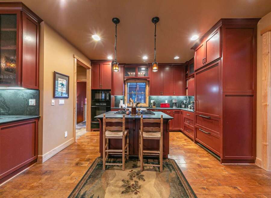 Step into this stunning kitchen, a perfect blend of rustic charm and modern convenience.
