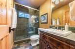 Step into this beautifully designed bathroom featuring a walk-in shower with a glass door and a stylish vanity.
