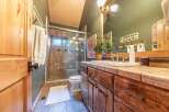Step into this beautifully designed bathroom, featuring a spacious glass-enclosed shower and a stylish vanity with ample storage.