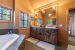 Step into luxury with this stunning bathroom! Featuring a spacious vanity with ample storage, a relaxing bathtub, and natural light, this space is perfect for unwinding.