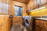 Step into this beautifully designed laundry room, featuring a modern washer and dryer set.
