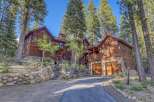 Nestled amidst towering trees, this stunning wooden cabin offers a serene retreat.