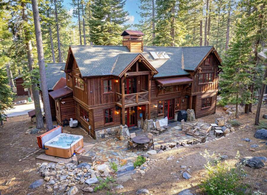 Nestled in a serene forest setting, this stunning property boasts a luxurious hot tub, perfect for relaxation.