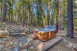 Escape to your own private oasis with this stunning property featuring a luxurious hot tub nestled amidst a serene forest setting.
