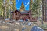 Escape to your dream mountain retreat! This stunning cabin boasts a rustic charm with its wooden exterior and inviting outdoor spaces.