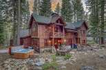 Escape to your dream mountain retreat! This stunning cabin boasts a rustic charm with its wooden exterior and inviting ambiance.