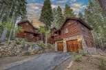 Nestled amidst towering trees, this stunning wooden cabin offers a serene escape.