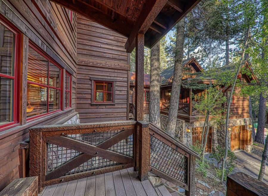 Nestled in a serene, wooded setting, this stunning property boasts exquisite wooden architecture and a charming rustic design.