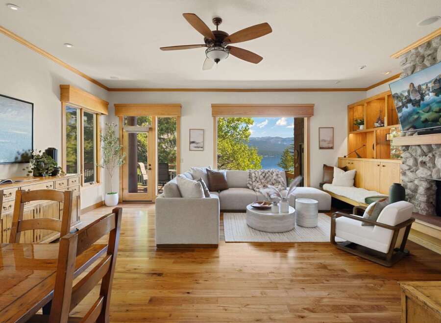 Experience luxury living in this stunning property, featuring a spacious living room with a cozy fireplace and a modern design.