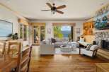 Experience luxury living in this stunning property, featuring a spacious living room with a cozy fireplace and a modern design.