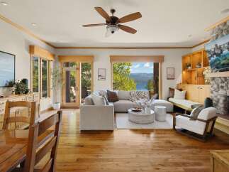 Experience luxury living in this stunning property, featuring a spacious living room with a cozy fireplace and a modern design.