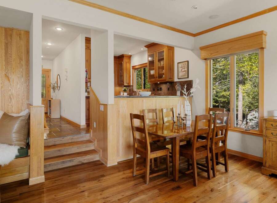 Step into this stunning home featuring a warm and inviting dining area.