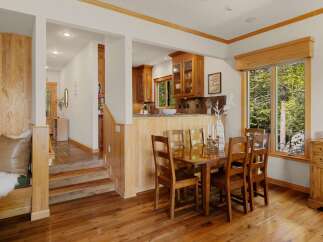 Step into this stunning home featuring a warm and inviting dining area.