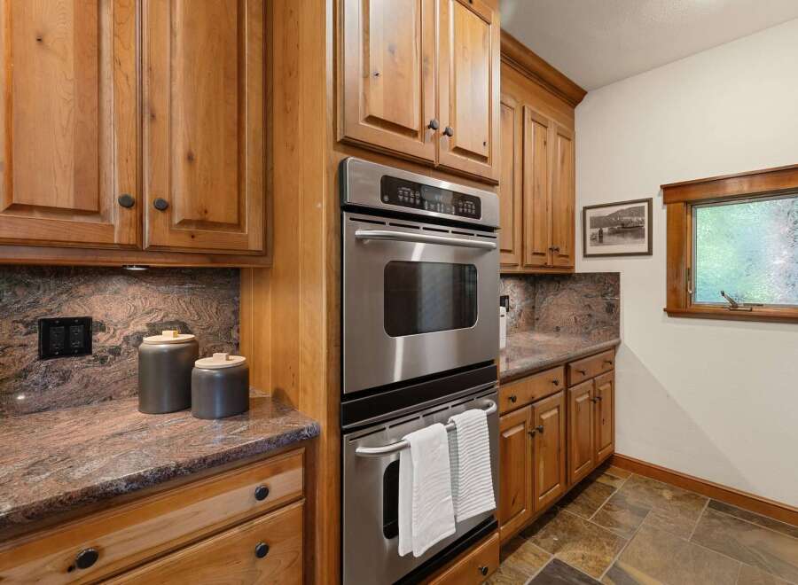 This stunning kitchen boasts custom cabinetry and high-end stainless steel appliances.