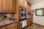 This stunning kitchen boasts custom cabinetry and high-end stainless steel appliances.