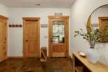 Step into this inviting entryway, showcasing a blend of rustic charm and modern design.