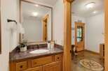 Step into luxury with this stunning bathroom featuring a beautiful vanity and a large mirror.
