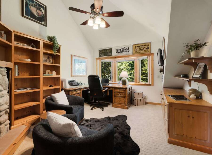 This stunning home office boasts a cozy and inviting atmosphere, perfect for productivity and relaxation.