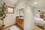This charming bathroom features a stylish vanity with ample storage and a sleek countertop.