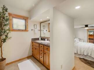 This charming bathroom features a stylish vanity with ample storage and a sleek countertop.