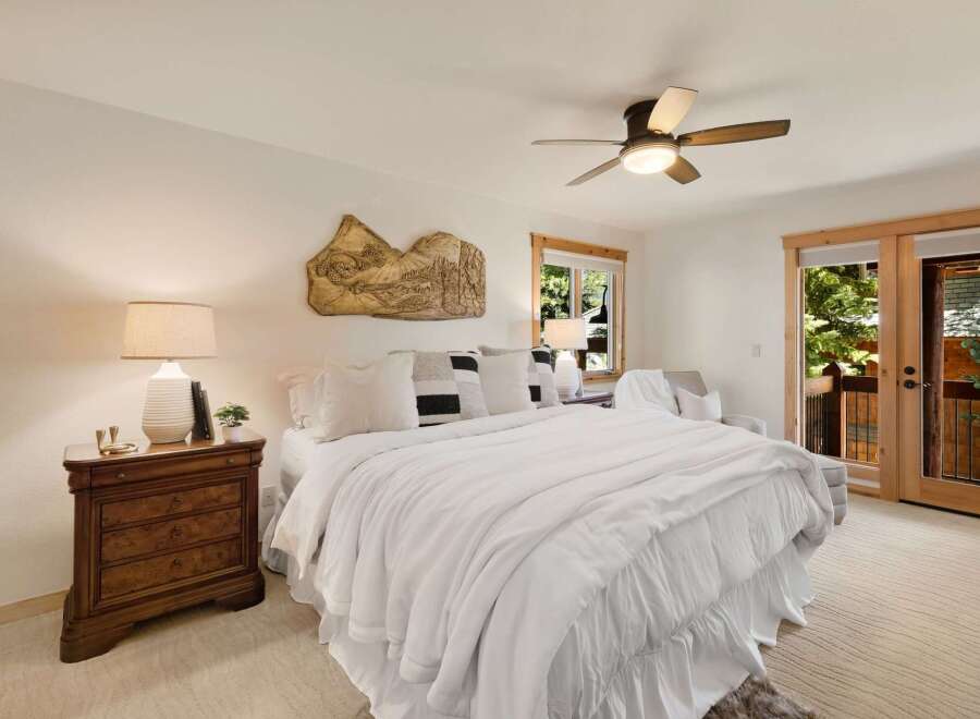 This stunning bedroom offers a serene retreat with its bright and airy ambiance.