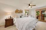 This stunning bedroom offers a serene retreat with its bright and airy ambiance.