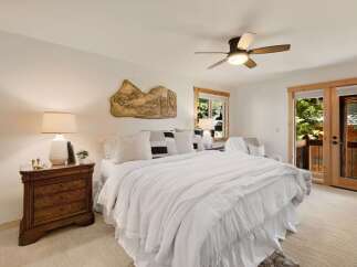This stunning bedroom offers a serene retreat with its bright and airy ambiance.